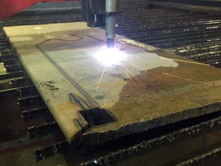 Thick steel being cut to shape in CNC Plasma table